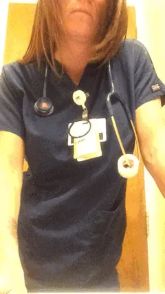 busty nurse takes off her top