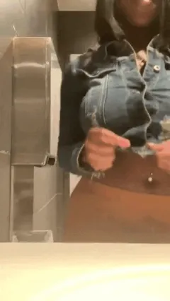 girlfriend flashes her big tits in restaurant bathroom