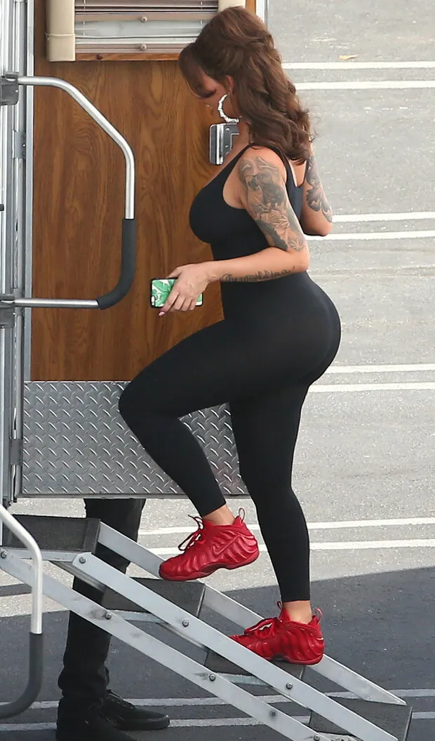 amber rose climbing into a trailer