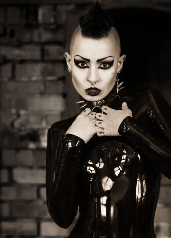 toxic devil is a sinister yung goth model in black latex with her weird hair emo mo hawk - fota lett gothh ppale collar