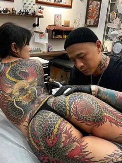 beautiful asian with a legendary tattoo