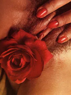 closeup hairy and moist pussy with flower insertion