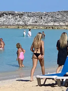 hot blonde milf walking on beach in bahamas