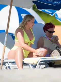 iskra lawrence pregnant in a sexy bikini showing nice cleavage with her big boobs seen at the beach by paparazzi.