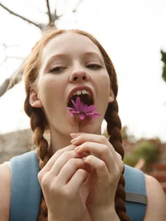 silly redhead wendy patton with braided pigtails