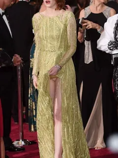 emma stone upskirt wardrobe malfunction on the red carpet showing her legs and panties caught by paparazzi.