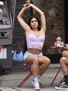 lourdes leon braless boobs in a sexy little purple top showing off her tits pokies as well as armpit hair seen by paparazzi smoking weed.