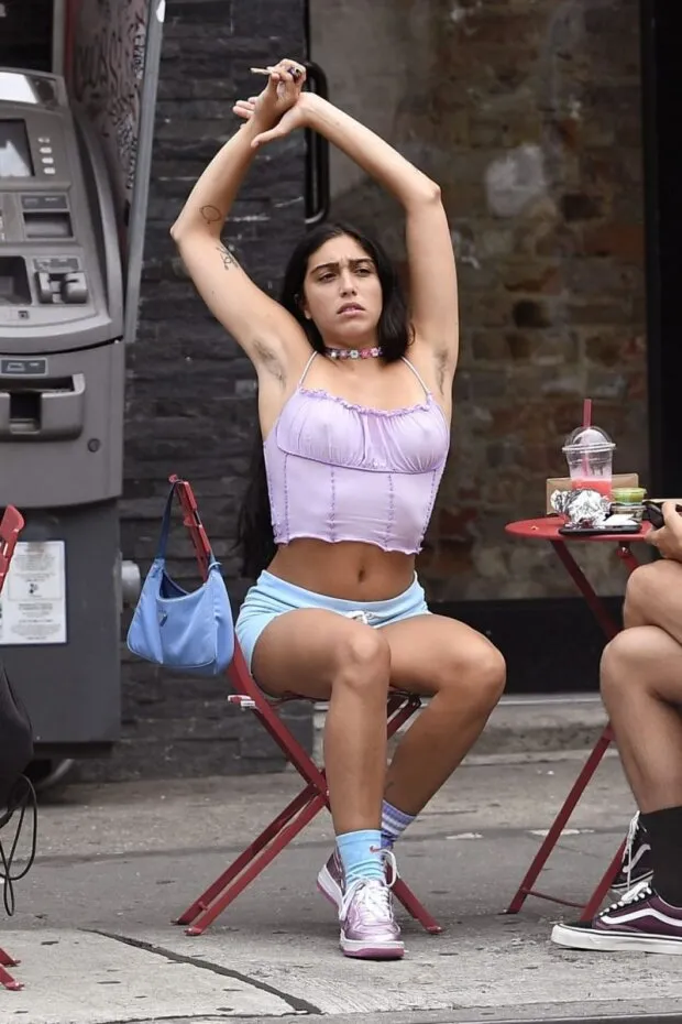 lourdes leon braless boobs in a sexy little purple top showing off her tits pokies as well as armpit hair seen by paparazzi smoking weed.