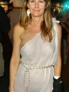 nude in see through dress at a party.