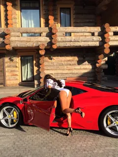 rich babe in heels by her ferrari