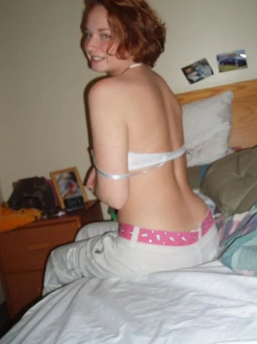 cute hedhead amateur sit on bed