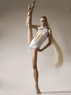 skinny, flexible blonde in a slutty white leotard