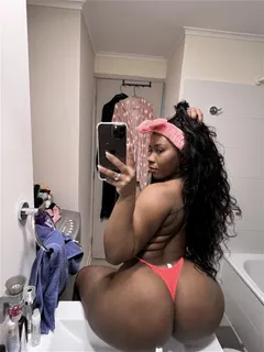 chick with a big ol booty taking a selfie