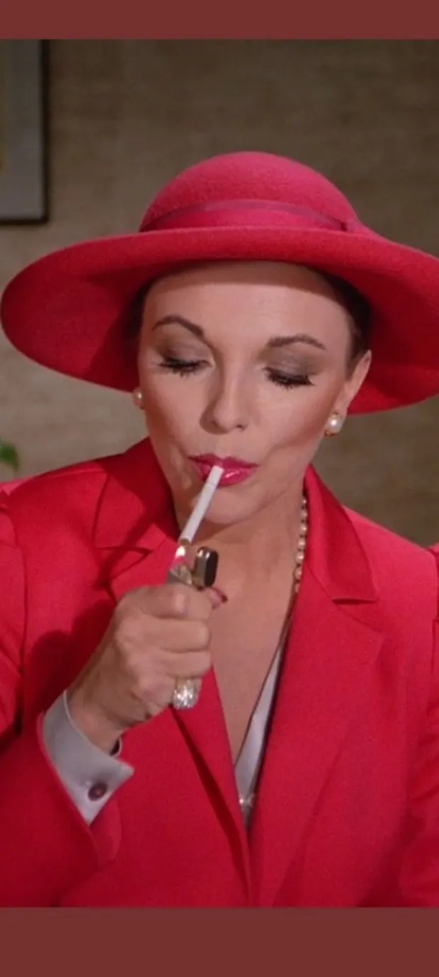 joan collins smoking ❤