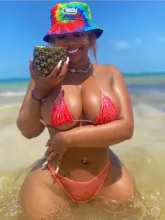 ravie loso in a bikini and a bucket hat