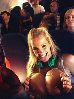 bimbo milf flashing on the plane