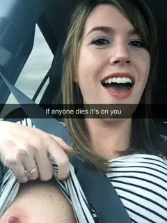 amateur cutie showing off a tit in the car