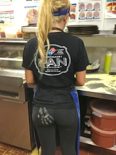 flour handprint on her black yoga pants ass