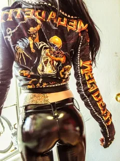 evil evi kane is a bad ass heavy metal style chick in a mega deth jacket w/ shiney latex pants