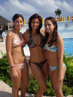 sexy mom and two daughters at the beach