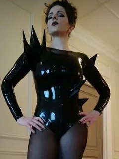 mandy star is weird chick in bizarre odd black latex suit with points on her strange outfit - pvc weirdd lett fota ppale skin ggg