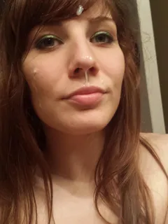 a lovely, fresh amateur face but...she has cum on her face and is having her photo taken.