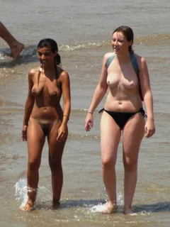 nudist teen at beach with topless friend