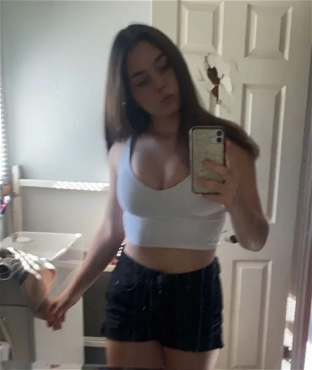 beatrix bathroom selfie white top