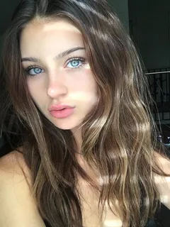 bright blue-eyed brunette with plump lips