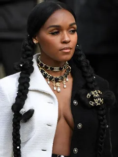 janelle monae braless boobs showing nice cleavage with her big tits in an open jacket top seen by paparazzi in paris for fashion week.