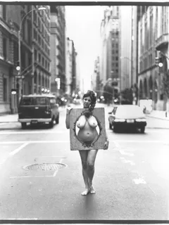 annie sprinkle - standing in the middle of the street in the nude.