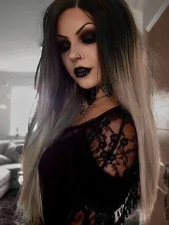 beautiful goth chick taking a selfie.