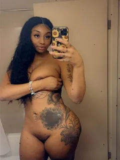 sophia ifeoma selfie showing off her body and her tattoos