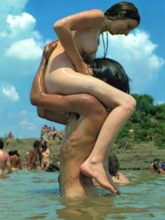 grrrlfriend frolicking with some guy at the naked beach party