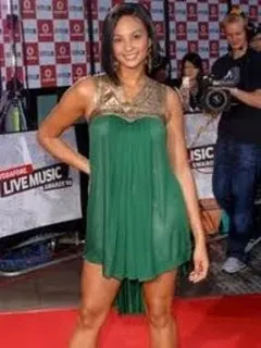 hot brit singer in hot, green dress