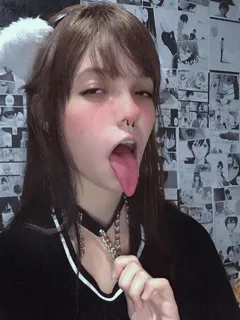 pierced nose teen sticks tongue out