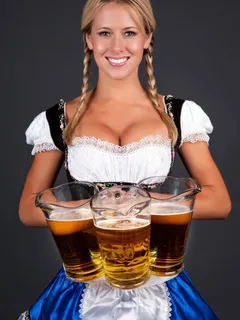 perfect german woman with beer in dirndl