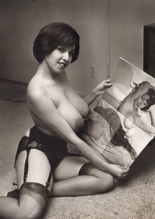 vintage pin-up model with huge natural tits and short hair wearing lingerie