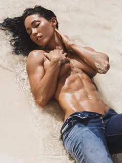 julia shelley laying on the sand