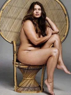 curvy, bbw girl looking cute and sexy in that huey p. newton-style wicker throne chair!