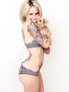 sexy blonde with tattoos and little dog.