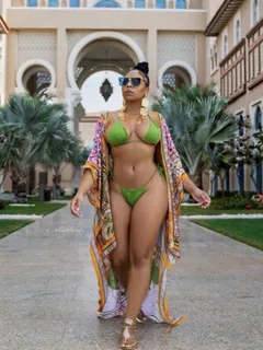 ashanti looking sexy in her green bikini