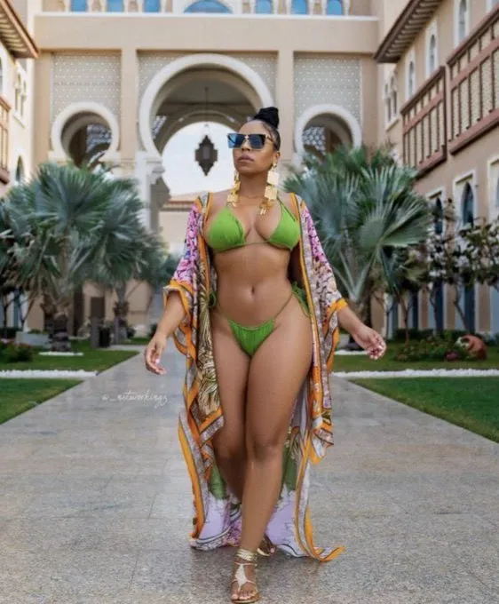 ashanti looking sexy in her green bikini