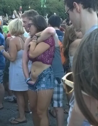 as her legs tremble he holds her up while she cums in front of everyone at the concert.