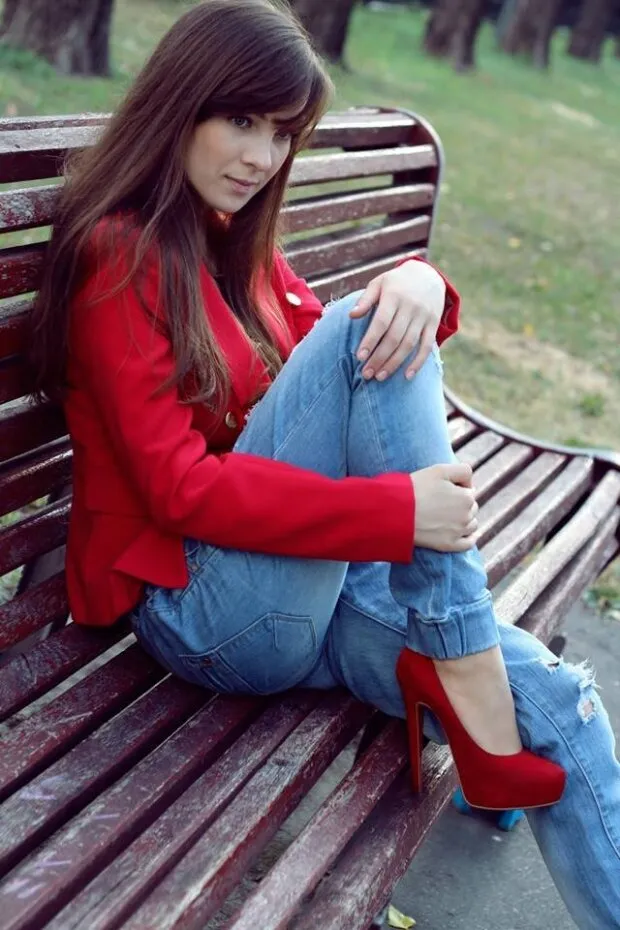 nice brunette rookie in seductive red heels and coat