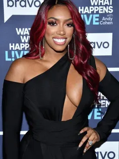 porsha williams braless boobs in a revealing black dress showing off her big tits cleavage.