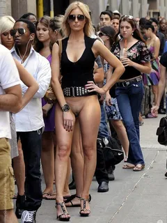 hot blonde nude from the waist down casually waiting in line