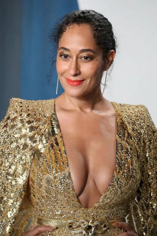 tracee ellis ross braless boobs showing nice cleavage with her big tits in a low cut sexy gold dress at the vanity fair oscar party.