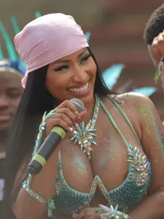 nicki minaj has a bit of nip slip areola peek wardrobe malfunction seen by paparazzi while showing off her big tits during carnival.