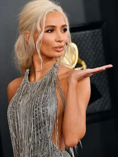 pia mia braless boobs showing nice sideboob cleavage in a sexy little dress on the red carpet of the grammy awards.